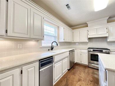Large kitchen with island, solid surface counterto