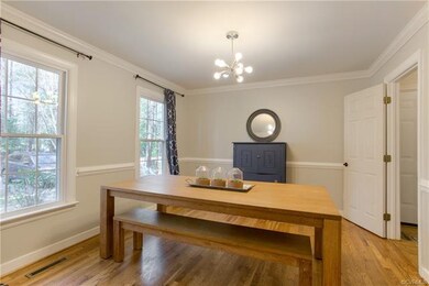 Formal Dining Room includes hardwood floors, a cha