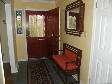 Foyer with stained glass, ceramic floor, & coat cl
