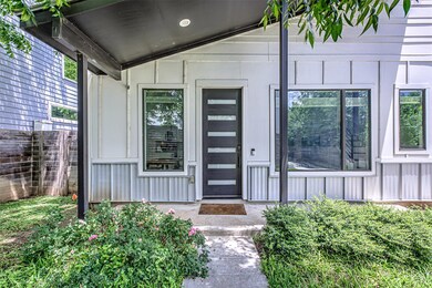 Property entrance featuring board and batten sidi