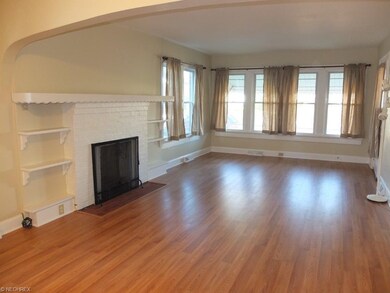 Living room with fireplace is open to the dining r