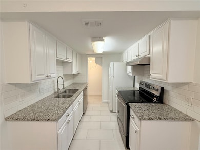 Kitchen featuring appliances with stainless steel
