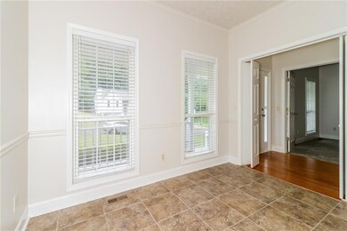 Unfurnished room with crown molding and hardwood /
