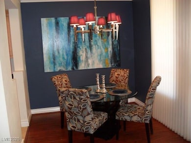 Dining room with a notable chandelier, wood finish