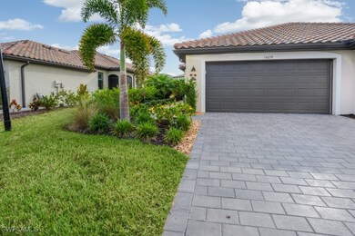 Garage featuring decorative driveway