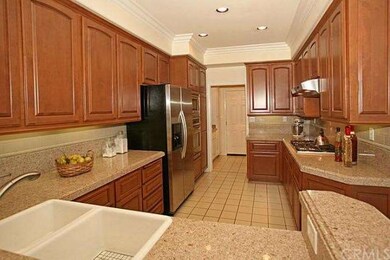 Upgraded Kitchen with Granite Countertops and Stai