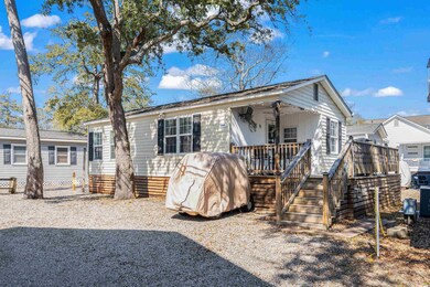 Back of property featuring stairway and a deck