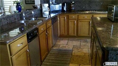 Stainless steel appliances w/ custom cabinetry