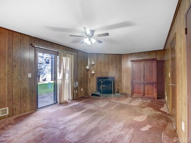 Lower level rec space; also leads to garage opening