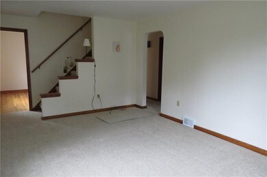 Living room looking into dining room and kitchen