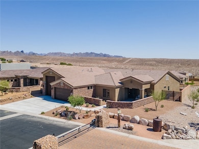 View of front of property featuring a gate, stucco