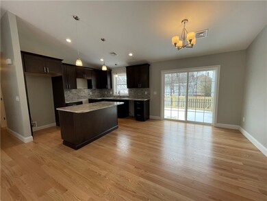 Kitchen and dining room with slider to the deck