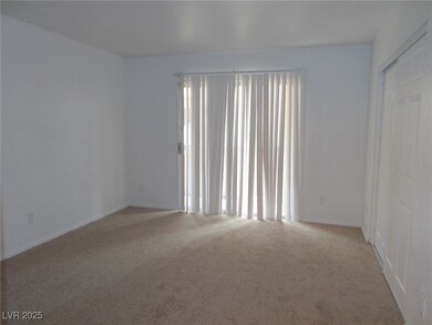 Carpeted spare room with baseboards