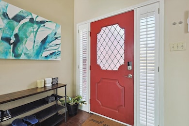 Entryway with dark hardwood / wood-style floors