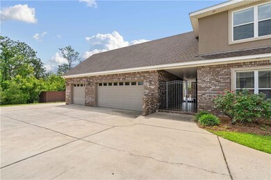 View of front of home featuring fence, brick sidin