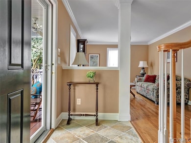Foyer featuring half wall with Column and Custom N