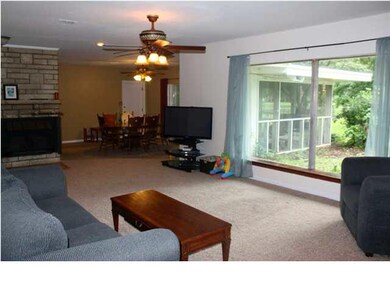 LIVING ROOM FEATURES A PICTURE WINDOW FOR VIEW OF 