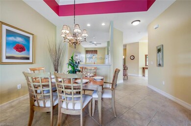Tiled dining room featuring ceiling fan with notab