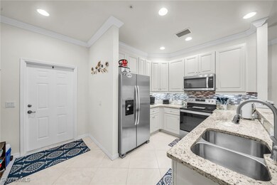 Kitchen with visible vents, a sink, ornamental mol