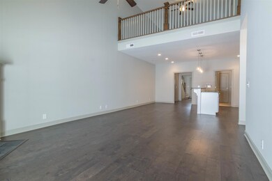 Balcony overlooks living room.