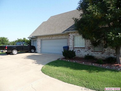 3-car side entry garage also has a workshop area.