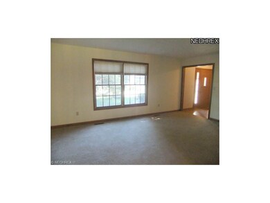 To the right of the foyer is the home's living roo