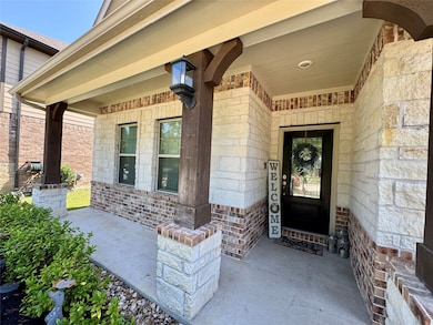 Covered porch welcomes you into your new home!