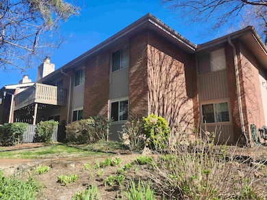 View of side of property featuring brick siding an