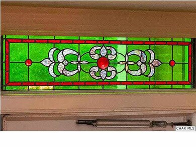 Stained glass detail over the front door.