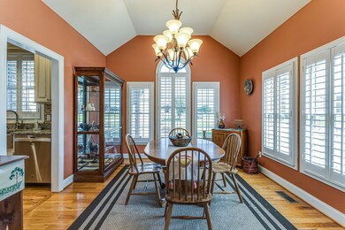 The formal dining room has a raised ceiling and lots of natural light.