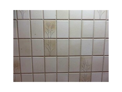 Kitchen. Tiled backsplash helps keep your kitchen 