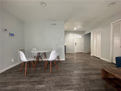 Dining area with wood finished floors and recessed