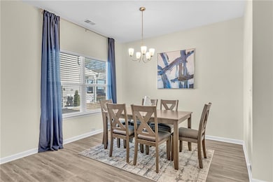 Dining room with hardwood / wood-style floors and 