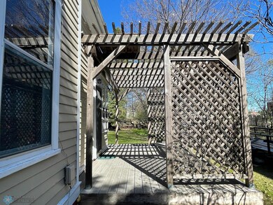 Wrap-around deck with pergola