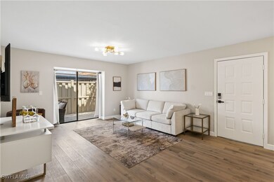 The room is bathed in natural light from large sli