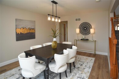 The dining room is connected to the kitchen. Bring
