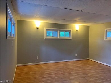 Bedroom featuring a paneled ceiling and wood-style flooring