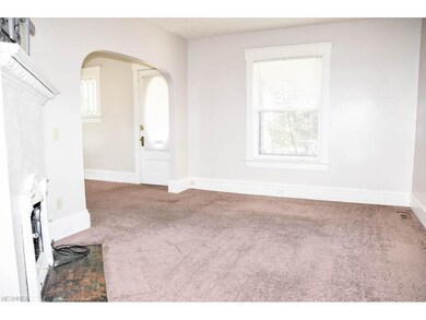 Formal living room with arched doorways.