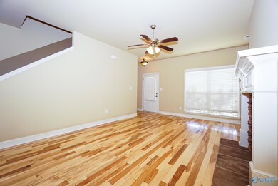 Brand new gorgeous real hardwood floors with gas fireplace. Open to kitchen bar, dining area and covered back porch for easy entertaining and relaxing. Surround sound speaker hookups pre-wired.