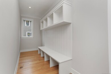 expansive Mudroom with custom built ins