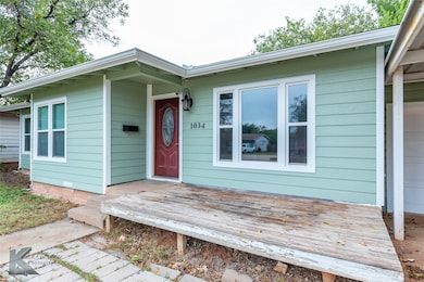 View of exterior entry featuring a deck