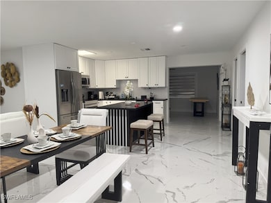 Kitchen with stainless steel appliances, tasteful