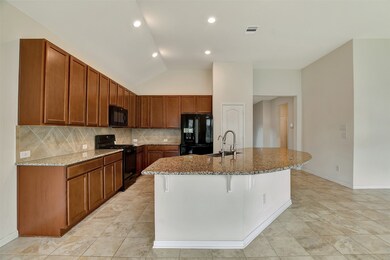 Large open kitchen with
a breakfast bar