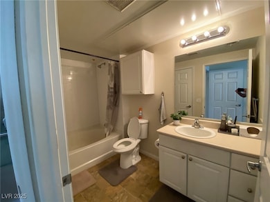 Full bathroom with shower / bath combination with curtain, toilet, vanity, baseboards, and visible vents