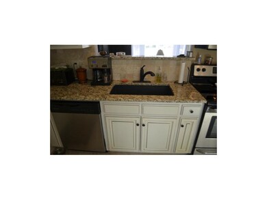 Newer Enameled Cabinets, Granite Countertops, Tile