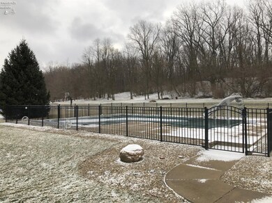 Fenced in swimming pool.