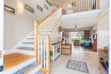 Entryway with a view to upstairs great room or downstairs pool area