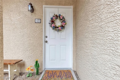 Entrance to property featuring stucco siding