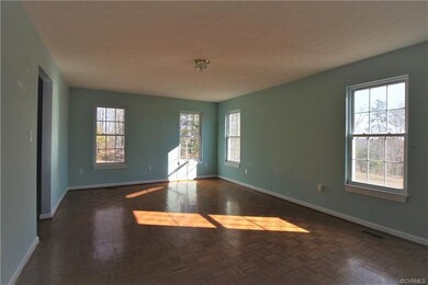 Extra spacious living room complete with wood parq