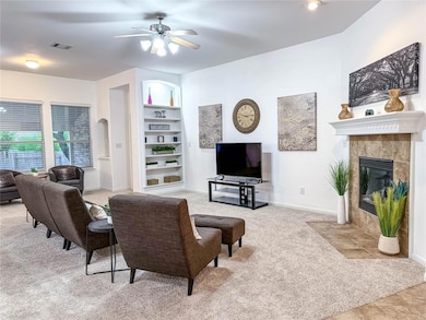 Living room with light colored carpet, a ceiling 